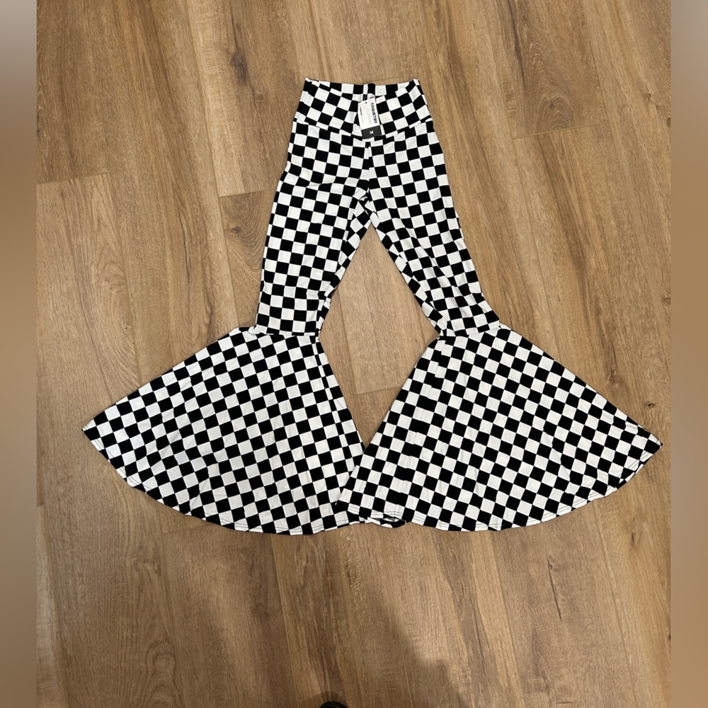 Black/white checkered bell bottoms from Coquetry Clothing, black light reactive
